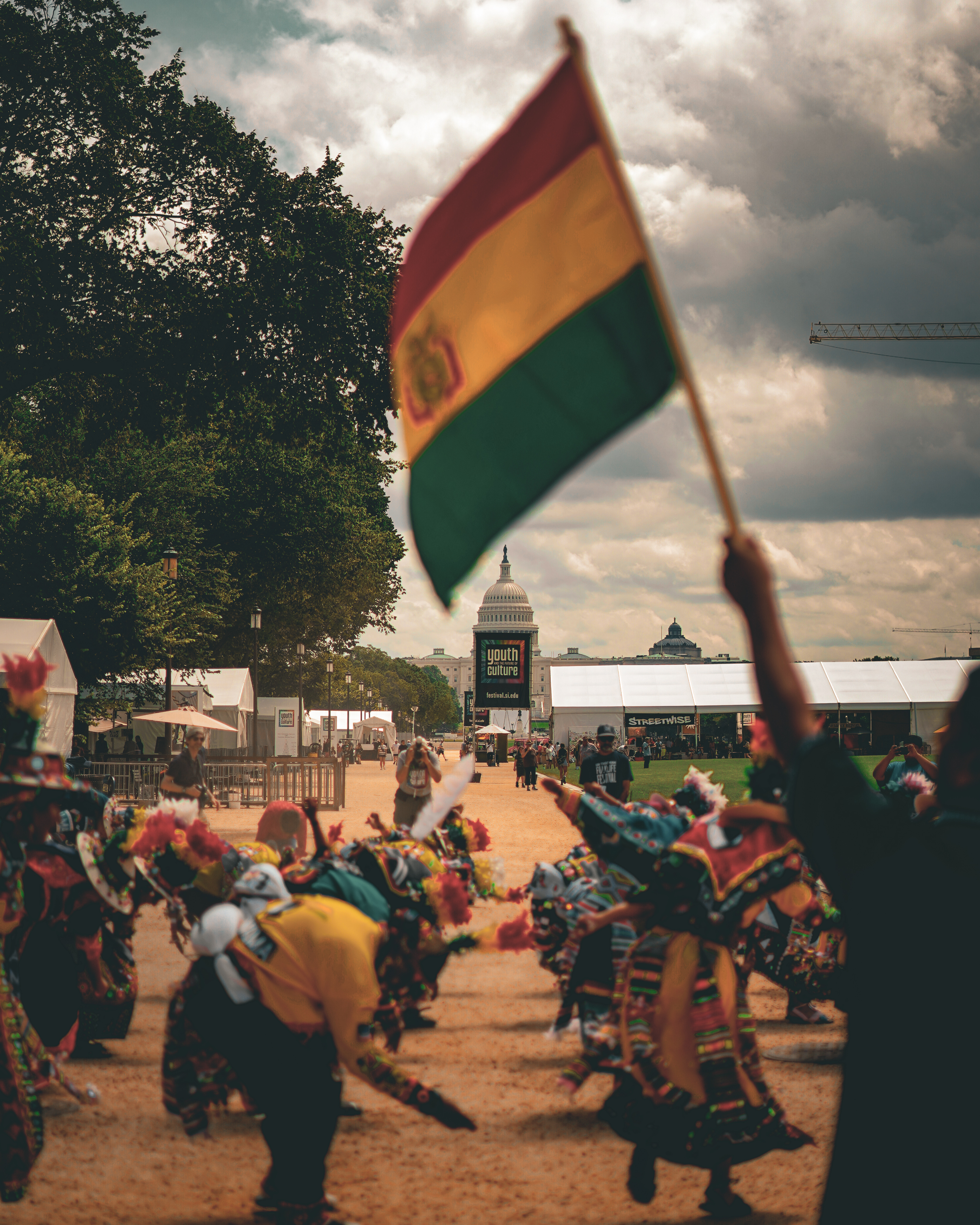 Festival street scene with yellow umbrellas